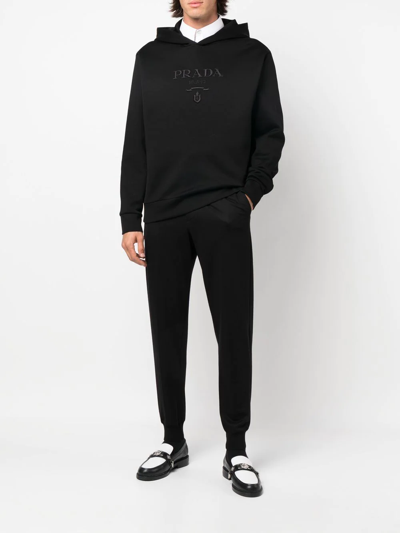 Shop Prada Tapered Cotton Trousers In Schwarz