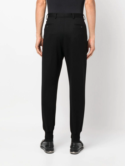 Shop Prada Tapered Cotton Trousers In Schwarz