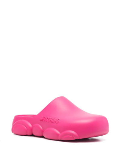 Moschino Mules With Embossed Logo In Pink