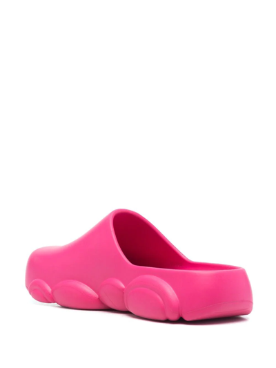 Shop Moschino Logo Embossed Mules In Pink