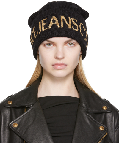 Shop Versace Jeans Couture Black & Gold Logo Beanie In Eg89 899 + 948