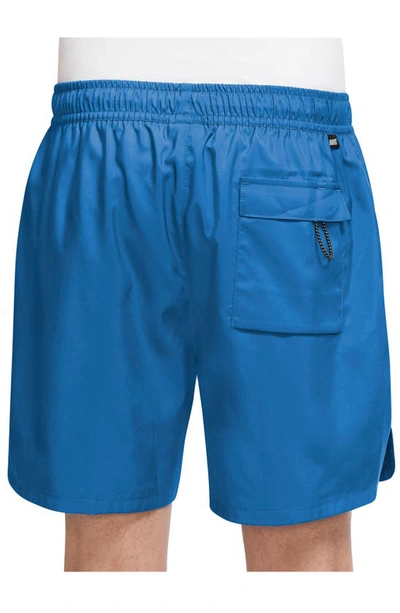 Shop Nike Woven Lined Flow Shorts In Lt Photo Blue/ White