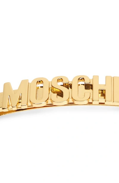 Shop Moschino Logo Hair Clip In Shiny Gold