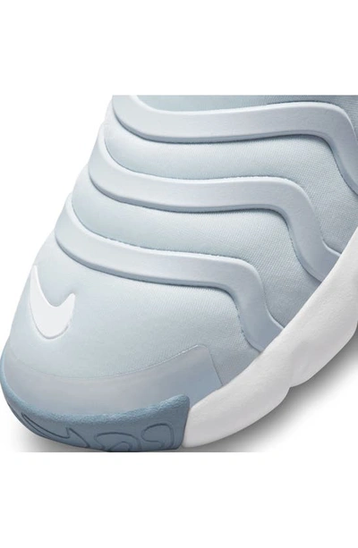 Shop Nike Kids' Dynamo Go Sneaker In Aura/ Light Brown/ Blue/ White