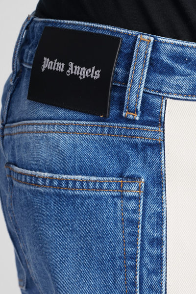 Shop Palm Angels Jeans In Cyan Denim
