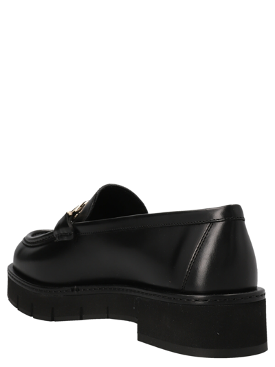 Shop Ferragamo Rolo Lug Loafers In Black