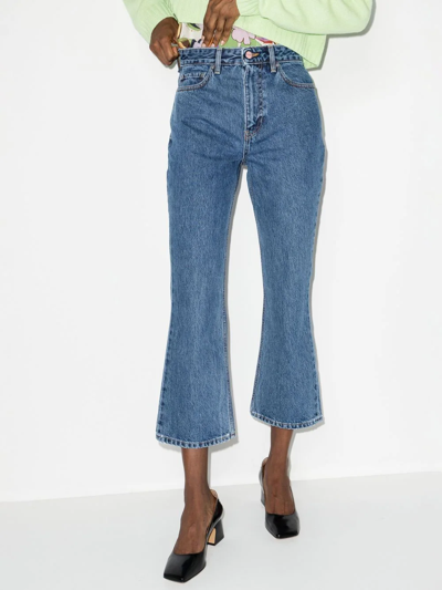 Shop Ganni Betzy Organic Cotton Flared Cropped Jeans In Blue