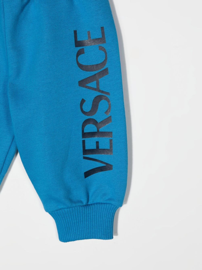 Shop Versace Logo-print Tapered Joggers In Blue