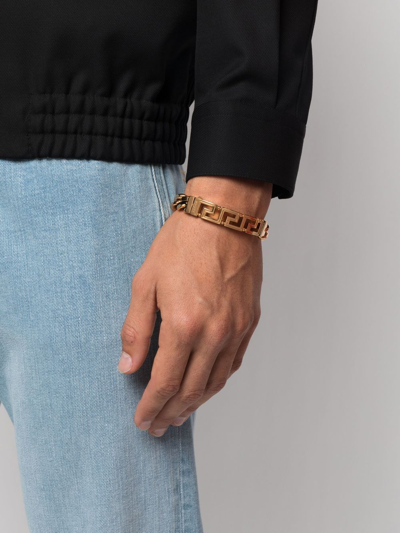 Shop Versace Greca Curb-chain Bracelet In Gold
