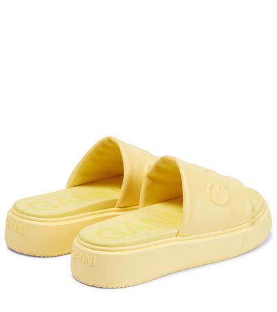Shop Ganni Logo Rubber Slides In Pale Banana