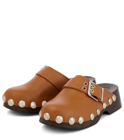 Shop Ganni Embellished Leather Clogs In Tiger's Eye