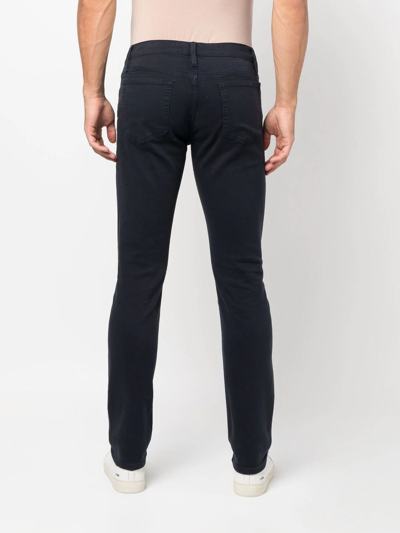 Shop Frame Low-rise Slim-fit Jeans In Blau