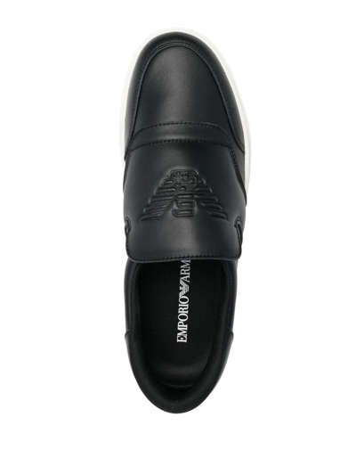 Shop Emporio Armani Embossed-logo Slip-on Sneakers In Schwarz