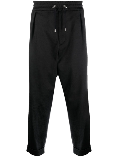 Shop Balmain 4g Pattern Tapered Trousers In Schwarz