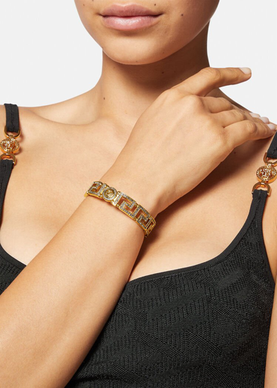 Shop Versace Crystal Medusa Greca Cuff Bracelet In Gold