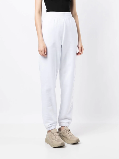 Shop Moncler Embossed-logo Cotton Track Pants In White