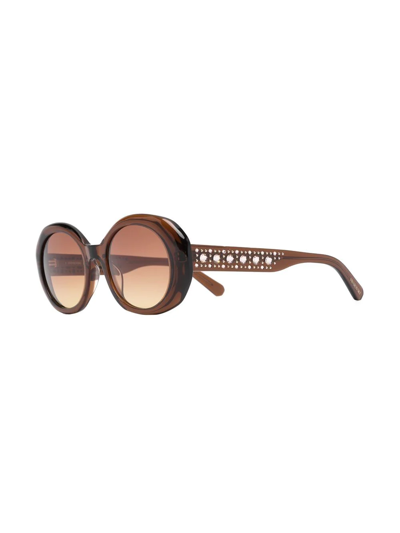 Shop Swarovski Crystal-embellished Oval-frame Sunglasses In Brown