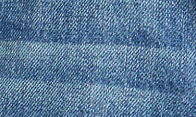 Good American Bombshell Distressed Denim Cutoff Shorts In Blue153