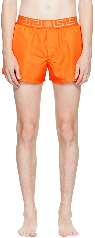 Versace Greca Print Orange Swim Shorts | ModeSens