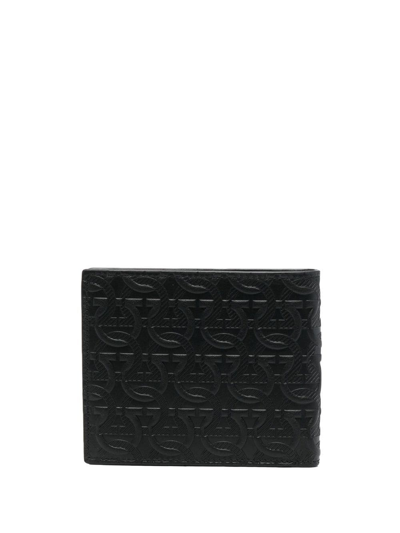 Shop Ferragamo All-over Embossed Gancini Wallet In Black