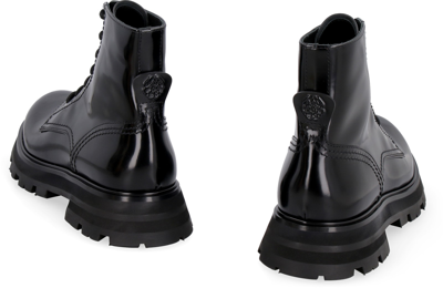 Shop Alexander Mcqueen Wander Leather Combat Boots In Black