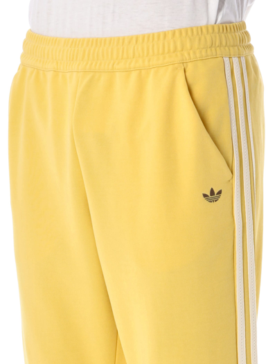 Shop Adidas Originals Track Pants In Yellow Brown