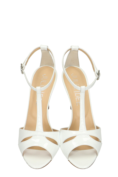 Shop Julie Dee Sandals In White Patent Leather