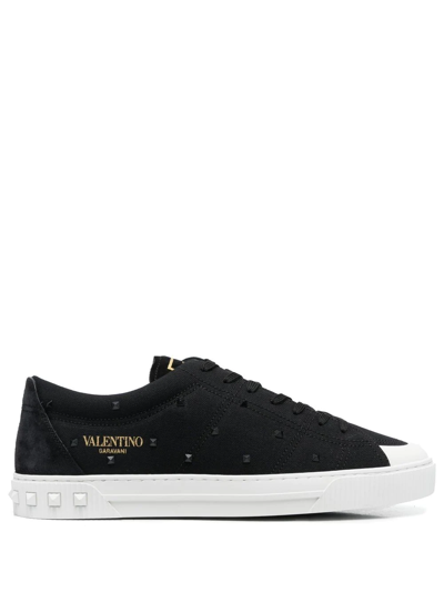 Shop Valentino Rockstud-embellished Sneakers In Schwarz