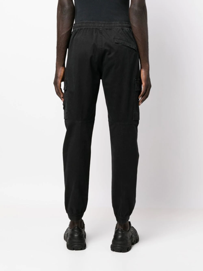 Shop Stone Island Compass-patch Cargo Trousers In Schwarz