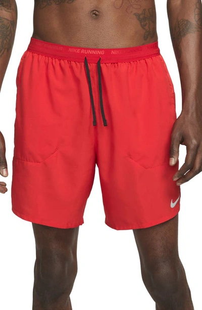 Shop Nike Dri-fit Stride 2-in-1 Running Shorts In University Red/ Black/ Black