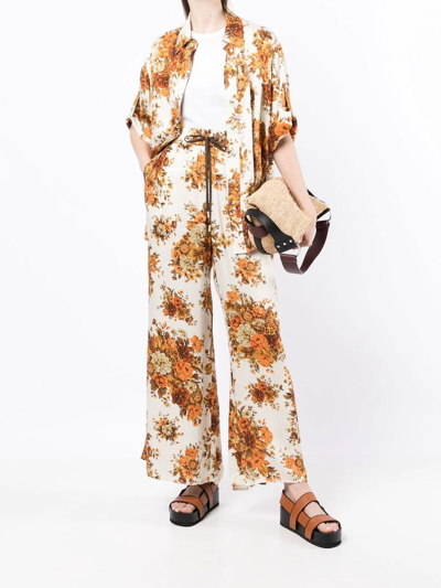 Shop Alemais Derby Floral-print Palazzo Trousers In Orange
