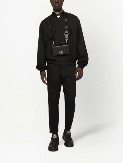 Dolce & Gabbana Solid Color Bomber Jacket With Embroidered Logo In Black