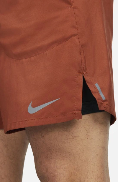 Shop Nike Flex Stride Performance Athletic Shorts In Rugged Orange/ Black