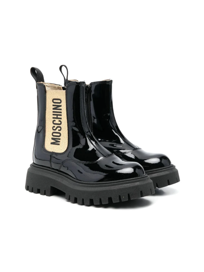 Shop Moschino Glossy Ankle Boots In Black