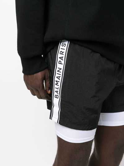 Shop Balmain Layered Logo-tape Shorts In Schwarz
