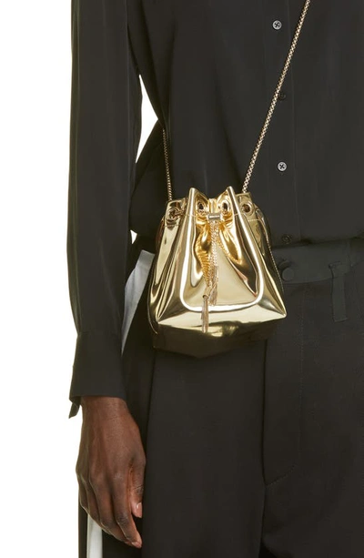 Jimmy Choo Shiny Mirror-effect Bon Bon Bag With Chain Drawstring And Metal Handle In Gold