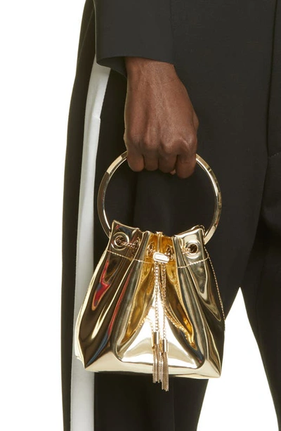 Jimmy Choo Shiny Mirror-effect Bon Bon Bag With Chain Drawstring And Metal Handle In Gold