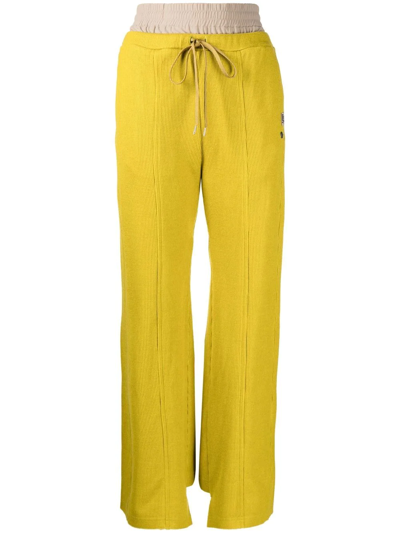Shop Miharayasuhiro Logo-patch Flared Trousers In Yellow