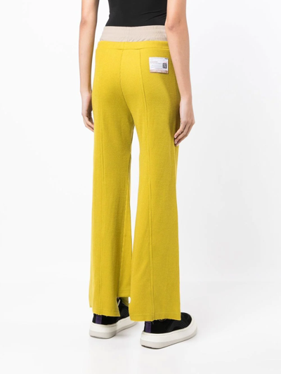 Shop Miharayasuhiro Logo-patch Flared Trousers In Yellow