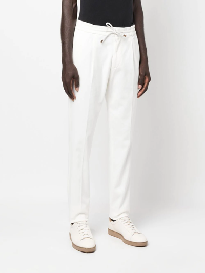 Shop Brunello Cucinelli Drawstring-waist Trousers In White