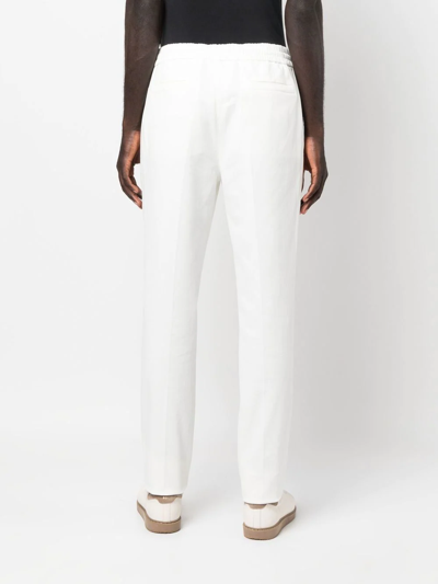 Shop Brunello Cucinelli Drawstring-waist Trousers In White