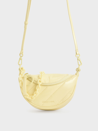 Shop Charles & Keith Philomena Glow-in-the-dark Saddle Bag In Butter