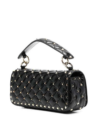 Shop Valentino Rockstud-embellished Shoulder Bag In Schwarz