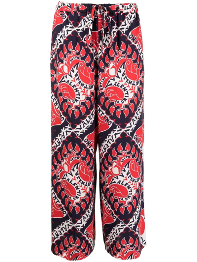 Shop Valentino Archive Manifesto-print Trousers In Rot