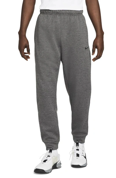 Shop Nike Therma-fit Tapered Training Pants In Heather/ Dark Grey/ Black