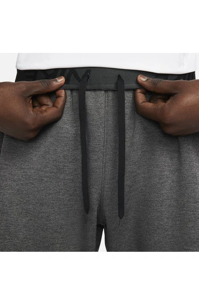 Shop Nike Therma-fit Tapered Training Pants In Heather/ Dark Grey/ Black