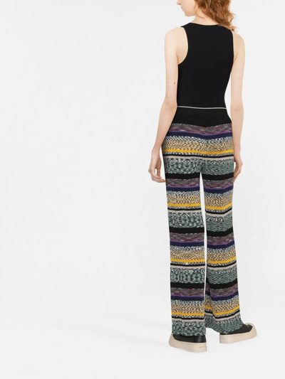 Shop Missoni Striped Knitted Trousers In Black