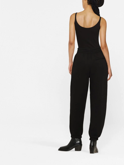 Shop Alexander Wang Logo-print Tapered Track Pants In Black