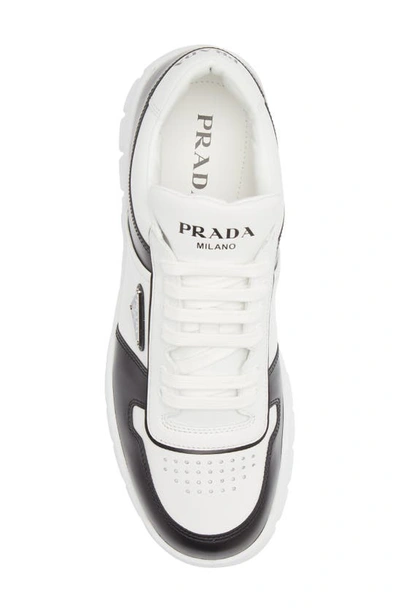 Shop Prada Leather Sneaker In White/ Black