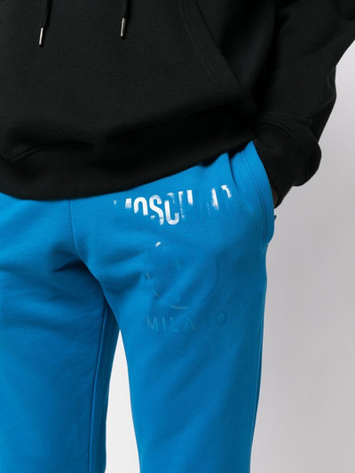 Shop Moschino Logo-print Track Pants In Blau